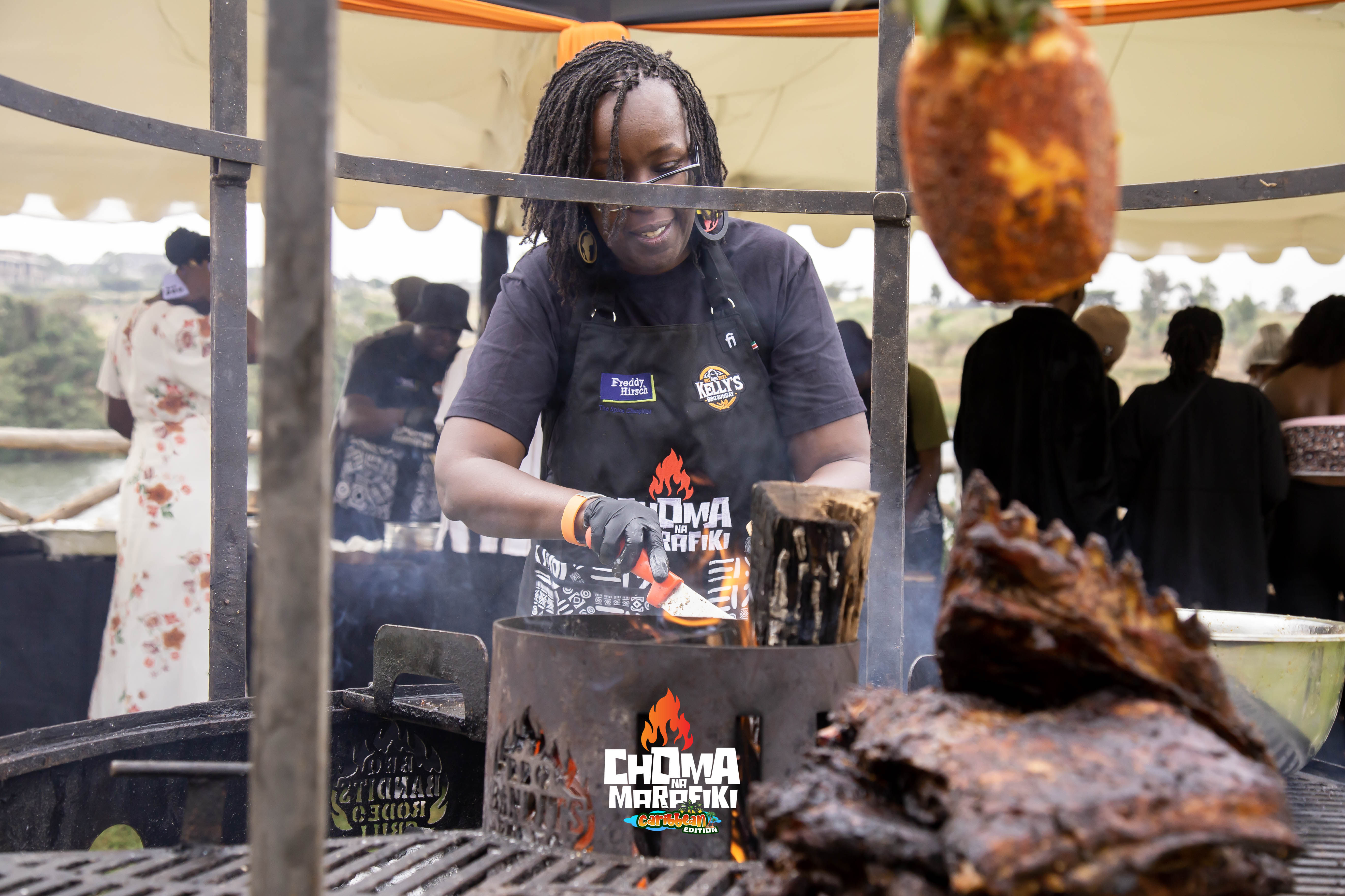 Grillmaster at work with pineapple decoration at Caribbean Edition event